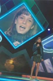Photo of Julie Dubela singing to a national TV audience on FOX's American Juniors