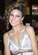 Photo of Julie Dubela modeling in fashion show