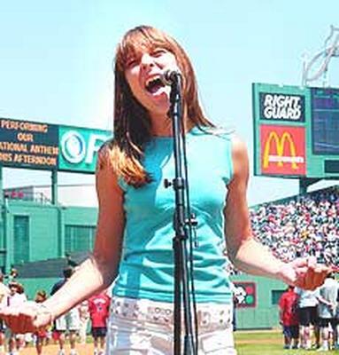 Photo of Julie Dubela singing the National Anthem at Fenway Park for Sox/Twins baseball game